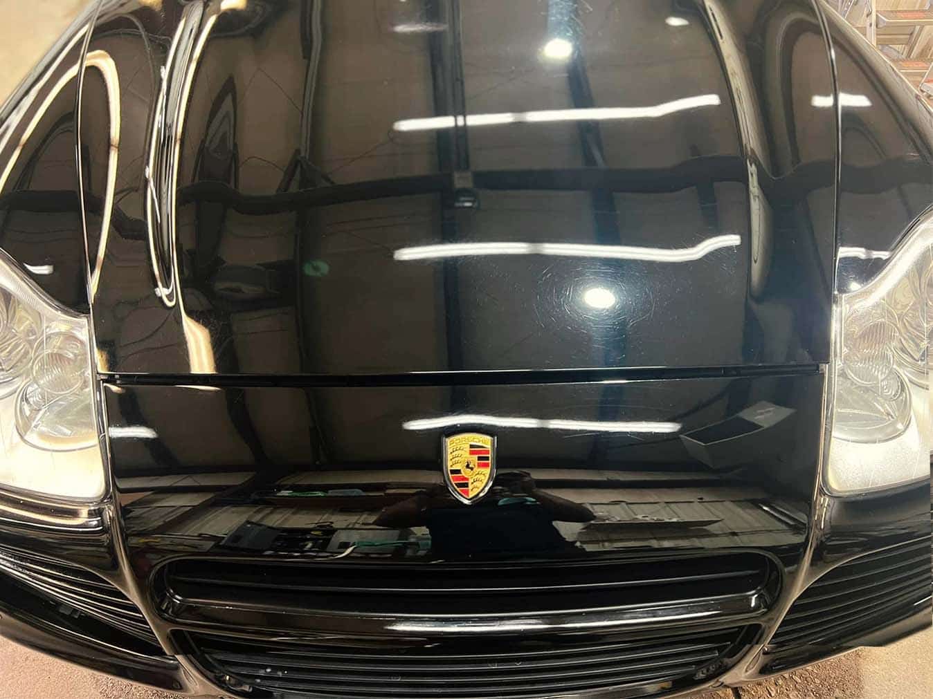 Home 26 Shiny black Porsche front view