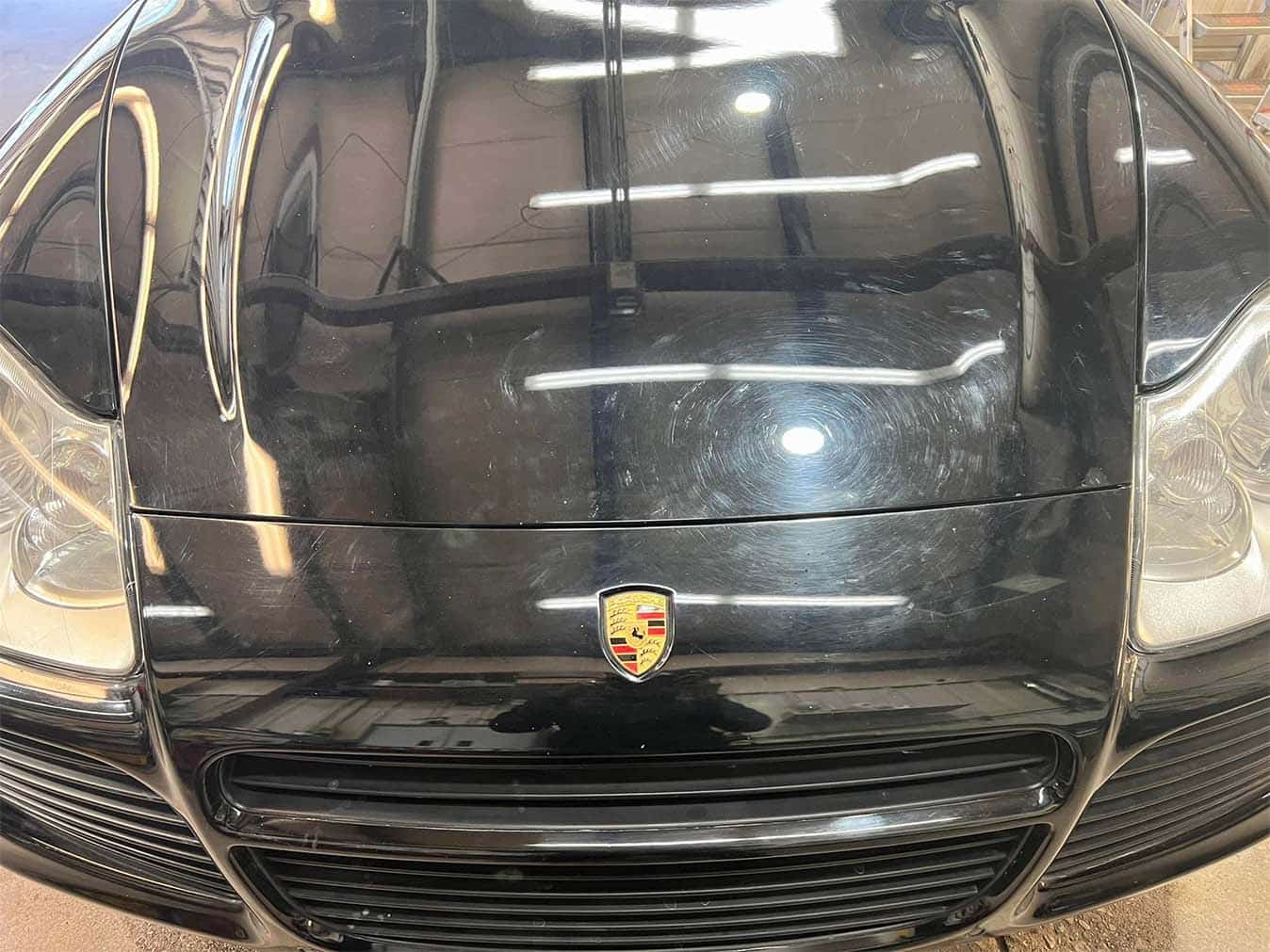 Home 25 Black Porsche with shiny hood